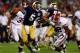 MIAMI GARDENS, FL - JANUARY 07: Everett Golson #5 of the Notre Dame Fighting Irish runs with the ball against C.J. Mosley #32 of the Alabama Crimson Tide during the 2013 Discover BCS National Championship game at Sun Life Stadium on January 7, 2013 in Mi