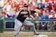 June 4, 2013; Philadelphia, PA, USA; Miami Marlins first baseman Casey Kotchman (18) records an out during the first inning against the Philadelphia Phillies at Citizens Bank Park. The Phillis defeated the Marlins 7-3 in 11 innings. Mandatory Credit: Howa