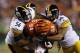 CINCINNATI, OH - OCTOBER 21: LaMarr Woodley #56 and Larry Foote #50 of the Pittsburgh Steelers combine to make a tackle against Jermaine Gresham #84 of the Cincinnati Bengals during the game at Paul Brown Stadium on October 21, 2012 in Cincinnati, Ohio. (