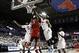 Mar 5, 2014; Dallas, TX, USA; Louisville Cardinals forward Montrezl Harrell (24) shoots against Southern Methodist Mustangs forward Ben Moore (34) and forward Markus Kennedy (5) and guard Ryan Manuel (1) during the first half of a mens basketball game at
