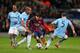 MANCHESTER, ENGLAND - FEBRUARY 18: Lionel Messi of Barcelona competes with Pablo Zabaleta and Vincent Kompany of Manchester City during the UEFA Champions League Round of 16 first leg match between Manchester City and Barcelona at the Etihad Stadium on F