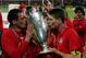 ISTANBUL, TURKEY - MAY 25: Liverpool captain Steven Gerrard (R) and defender Jamie Carragher kiss the European Cup after Liverpool won the European Champions League final against AC Milan on May 25, 2005 at the Ataturk Olympic Stadium in Istanbul, Turkey