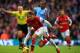 MANCHESTER, ENGLAND - DECEMBER 14: Aaron Ramsey of Arsenal and Fernandinho of Manchester City battle for the ball during the Barclays Premier League match between Manchester City and Arsenal at Etihad Stadium on December 14, 2013 in Manchester, England. (