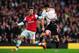 LONDON, ENGLAND - FEBRUARY 16: (L-R) Nacho Monreal of Arsenal and Luis Suarez of Liverpool challenge for the ball during the FA Cup Fifth Round match between Arsenal and Liverpool at the Emirates Stadium on February 16, 2014 in London, England. (Photo b