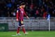 SAN SEBASTIAN, SPAIN - FEBRUARY 22: Lionel Messi of FC Barcelona reacts after Antoine Griezmann of Real Sociedad scored his team's second goal goal during the La Liga match between Real Sociedad and FC Barcelona at Estadio Anoeta on February 22, 2014 in