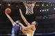 OAKLAND, CA - FEBRUARY 4: Josh McRoberts #11 of the Charlotte Bobcats dunks against Andrew Bogut #12 of the Golden State Warriors on February 4, 2014 at Oracle Arena in Oakland, California. NOTE TO USER: User expressly acknowledges and agrees that, by dow