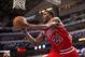 Feb 28, 2014; Dallas, TX, USA; Chicago Bulls shooting guard Jimmy Butler (21) passes the ball under the basket during the second half against the Dallas Mavericks at the American Airlines Center. The Bulls defeated the Mavericks 100-91. Mandatory Credit:
