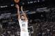 SAN ANTONIO, TX - March 6: Tim Duncan #21 of the San Antonio Spurs takes a shot during a game against the Miami Heat at the AT&T Center on March 6, 2014 in San Antonio, Texas. NOTE TO USER: User expressly acknowledges and agrees that, by downloading and o