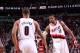 PORTLAND, OR - MARCH 16: Damian Lillard #0 and LaMarcus Aldridge #12 of the Portland Trail Blazers shake hands against the Detroit Pistons on March 16, 2013 at the Rose Garden Arena in Portland, Oregon. NOTE TO USER: User expressly acknowledges and agrees