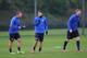 ST ALBANS, ENGLAND - FEBRUARY 18: Per Mertesacker, Mesut Ozil and Lukas Podolski of Arsenal warm up during a training session at London Colney on February 18, 2014 in St Albans, England. (Photo by Shaun Botterill/Getty Images)