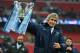 LONDON, ENGLAND - MARCH 02: Manuel Pellegrini, manager of Manchester City celebrates victory with the trophy after the Capital One Cup Final between Manchester City and Sunderland at Wembley Stadium on March 2, 2014 in London, England. (Photo by Michael
