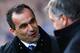 LIVERPOOL, ENGLAND - MARCH 01: Roberto Martinez (L), manager of Everton talks to Sam Allardyce, manager of West Ham United during the Barclays Premier League match between Everton and West Ham United at Goodison Park on March 1, 2014 in Liverpool, Englan