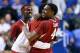 LEXINGTON, KY - FEBRUARY 27: Coty Clarke #4 of the Arkansas Razorbacks celebrates with a teammate after the 71-67 OT win over the Kentucky Wildcats at Rupp Arena on February 27, 2014 in Lexington, Kentucky. (Photo by Andy Lyons/Getty Images)