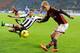 Allan dives to try and stop Honda's cross.