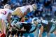CHARLOTTE, NC - JANUARY 12: Ahmad Brooks #55 of the San Francisco 49ers jumps over the offensive line of the Carolina Panthers in the second quarter during the NFC Divisional Playoff Game at Bank of America Stadium on January 12, 2014 in Charlotte, North