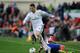 MADRID, SPAIN - MARCH 02: Cristiano Ronaldo (L) of Real Madrid CF beats Raul Garcia of Club Atletico de Madrid during the La Liga match between Club Atletico de Madrid and Real Madrid CF at Vicente Calderon Stadium on March 2, 2014 in Madrid, Spain. (P