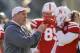 Nebraska head coach Bo Pelini visits with players during warmups as Iowa and Nebraska prepare to square off in an NCAA college football game in Lincoln, Neb., Friday, Nov. 29, 2013. (AP Photo/Nati Harnik)