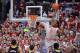 COLUMBUS, OH - FEBRUARY 11: Sam Thompson #12 of the Ohio State Buckeyes goes up for a dunk over the Michigan Wolverines defense in the first half on February 11, 2014 at Value City Arena in Columbus, Ohio. Thompson missed the shot. (Photo by Jamie Saba