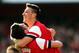 LONDON, ENGLAND - MARCH 08: Olivier Giroud of Arsenal celebrates with teammate Mesut Oezil after scoring his team's fourth goal during the FA Cup Quarter-Final match between Arsenal and Everton at Emirates Stadium on March 8, 2014 in London, England. (P
