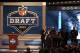 NEW YORK, NY - APRIL 25: Tavon Austin (R) of West Virginia Mountaineers reacts with NFL Commissioner Roger Goodell as they hold up a jersey on stage after Austin was picked #8 overall by the St. Louis Rams in the first round of the 2013 NFL Draft at Radi