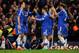 LONDON, ENGLAND - MARCH 08: Demba Ba (3rd L) of Chelsea celebrates with teammates after scoring his team's fourth goal during the Barclays Premier League match between Chelsea and Tottenham Hotspur at Stamford Bridge on March 8, 2014 in London, England.