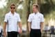 SAKHIR, BAHRAIN - APRIL 19: (L-R) Jenson Button of Great Britain and McLaren and Kevin Magnussen of Finland and McLaren walk in the paddock following practice for the Bahrain Formula One Grand Prix at the Bahrain International Circuit on April 19, 2013 i