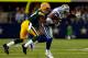 ARLINGTON, TX - DECEMBER 15: Wide receiver Dez Bryant #88 of the Dallas Cowboys is tackled by cornerback Sam Shields #37 of the Green Bay Packers during a game at AT&T Stadium on December 15, 2013 in Arlington, Texas. (Photo by Tom Pennington/Getty Image