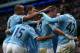 MANCHESTER, ENGLAND - FEBRUARY 22: Yaya Toure of Manchester City celebrates scoring the opening goal with his team-mates during the Barclays Premier League match between Manchester City and Stoke City at the Etihad Stadium on February 22, 2014 in Manches