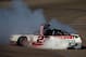 LAS VEGAS, NV - MARCH 08: Brad Keselowski, driver of the #22 Discount Tire Ford, celebrates with a burnout after winning the NASCAR Nationwide Series Boyd Gaming 300 at Las Vegas Motor Speedway on March 8, 2014 in Las Vegas, Nevada. (Photo by Jonathan F