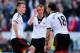 CARDIFF, WALES - MARCH 08: Cauley Woodrow (l) Steve Sidwell (c) and Konstantinos Mitroglou of Fulham react after the third Cardiff goal during the Barclays Premier league match between Cardiff City and Fulham at Cardiff City Stadium on March 8, 2014 in C