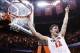 Mar 1, 2014; Charlottesville, VA, USA; Virginia Cavaliers guard Joe Harris (12) celebrates with the net after the Cavaliers game against the Syracuse Orange at John Paul Jones Arena. The Cavaliers won 75-56 and clinched the ACC regular season title. Manda