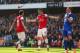 Olivier Giroud celebrates with an in-form Mesut Ozil.