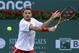 INDIAN WELLS, CA - MARCH 08: Stanislas Wawrinka of Switzerland returns a backhand to Ivo Karlovic of Croatia during the BNP Paribas Open at Indian Wells Tennis Garden on March 8, 2014 in Indian Wells, California. (Photo by Jeff Gross/Getty Images)