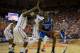 GAINESVILLE, FL - MARCH 08: Julius Randle #30 of the Kentucky Wildcats is defended by Will Yeguete #15 and Patric Young #4 of the Florida Gators during the second half of the game at the Stephen C. O'Connell Center on March 8, 2014 in Gainesville, Florida