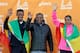 Gebo Burka, left, and Amane Gobena, both of Ethiopia, celebrate their victory with their coach Haji Adillo, center, after the Los Angeles Marathon in Santa Monica, Calif., Sunday, March 9, 2014. (AP Photo/Reed Saxon)