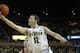 ANN ARBOR, MI - MARCH 8: Nik Stauskas #11 of the Michigan Wolverines goes in for a layup past Will Sheehey #0 of the Indiana Hoosiers during the first half of a basketball game on March 8, 2014, in Ann Arbor, Michigan. (Photo by Duane Burleson/Getty Imag