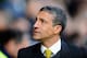NORWICH, ENGLAND - MARCH 08: Manager of Norwich City Chris Houghton looks on during the Barclays Premier League match between Norwich City and Stoke City at Carrow Road on March 08, 2014 in Norwich, England. (Photo by Tom Dulat/Getty Images)