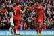 LIVERPOOL, ENGLAND - FEBRUARY 23: Daniel Sturridge of Liverpool celebrates scoring his team's third goal with Luis Suarez during the Barclays Premier League match between Liverpool and Swansea City at Anfield on February 23, 2014 in Liverpool, England.