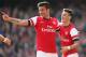 LONDON, ENGLAND - MARCH 08: Olivier Giroud of Arsenal celebrates with teammate Mesut Oezil after scoring his team's fourth goal during the FA Cup Quarter-Final match between Arsenal and Everton at Emirates Stadium on March 8, 2014 in London, England. (P