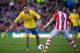 STOKE ON TRENT, ENGLAND - MARCH 01: Mesut Ozil of Arsenal competes with Glenn Whelan of Stoke City during the Barclays Pemier League match between Stoke City and Arsenal at the Britannia Stadium on March 1, 2014 in Stoke on Trent, England. (Photo by Mic