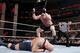 Brock Lesnar cracks a chair across Big Show's back at the Royal Rumble.
