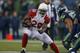 SEATTLE, WA - DECEMBER 22: Running back Rashard Mendenhall #28 of the Arizona Cardinals rushes against the Seattle Seahawks at CenturyLink Field on December 22, 2013 in Seattle, Washington. The Cardinals defeated the Seahawks 17-10. (Photo by Otto Greul