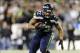 Dec 2, 2013; Seattle, WA, USA; Seattle Seahawks defensive end Michael Bennett (72) runs the ball in for a touchdown after recovering the fumble by New Orleans Saints quarterback Drew Brees (not pictured) during the 1st quarter at CenturyLink Field. Mandat
