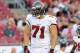 TAMPA, FL - AUGUST 29: Defensive end Trevor Scott #71 of the Tampa Bay Buccaneers sets for play against the Washington Redskins August 29, 2013 at Raymond James Stadium in Tampa, Florida. (Photo by Al Messerschmidt/Getty Images)