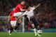 MANCHESTER, ENGLAND - SEPTEMBER 25: Jonny Evans of Manchester United competes with Luis Suarez of Liverpool during the Capital One Cup Third Round match betwen Manchester United and Liverpool at Old Trafford on September 25, 2013 in Manchester, England.