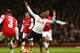 LONDON, ENGLAND - JANUARY 04: Danny Rose of Spurs is brought down by Serge Gnabry of Arsenal during the Budweiser FA Cup third round match between Arsenal and Tottenham Hotspur at Emirates Stadium on January 4, 2014 in London, England. (Photo by Clive R