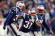 FOXBORO, MA - NOVEMBER 24: Cornerback Aqib Talib #31, free safety Devin McCourty #32, and defensive end Chandler Jones #95 of the New England Patriots celebrate a defensive play against the Denver Broncos during a game at Gillette Stadium on November 24