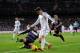 MADRID, SPAIN - NOVEMBER 30: Alvaro Morata (R) of Real Madrid CF is tackled by Marc Valiente of Real Valladolid CF during the La Liga match between Real Madrid CF and Real Valladolid CF at Santiago Bernabeu stadium on November 30, 2013 in Madrid, Spain.