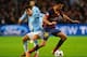 MANCHESTER, ENGLAND - FEBRUARY 18: Sergio Busquets of Barcelona competes with David Silva of Manchester City during the UEFA Champions League Round of 16 first leg match between Manchester City and Barcelona at the Etihad Stadium on February 18, 2014 in