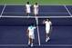 INDIAN WELLS, CA - MARCH 10: Jo-Wilfried Tsonga and Nicolas Mahut of France celebrate their win over Nenad Zimonjic of Serbia and Daniel Nestor of Canada during the BNP Parabas Open at the Indian Wells Tennis Garden on March 10, 2014 in Indian Wells, Ca